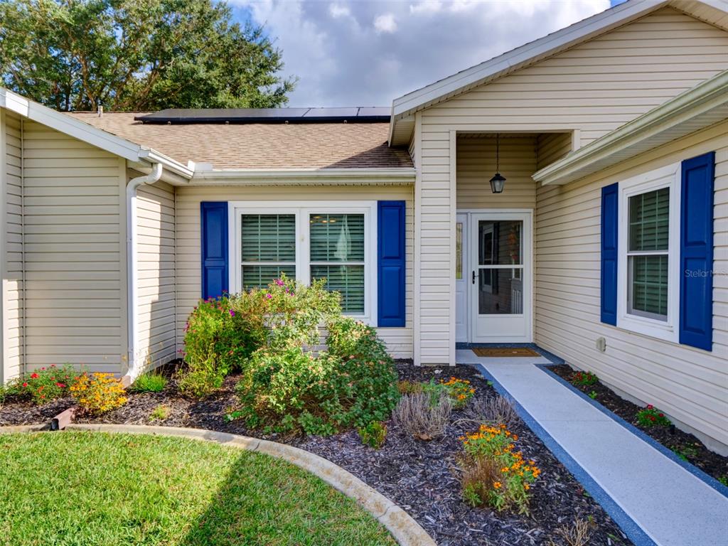 4704 River Ridge Drive Leesburg, FL 34748 - Photo 4 of 40 a front view of a house with a yard