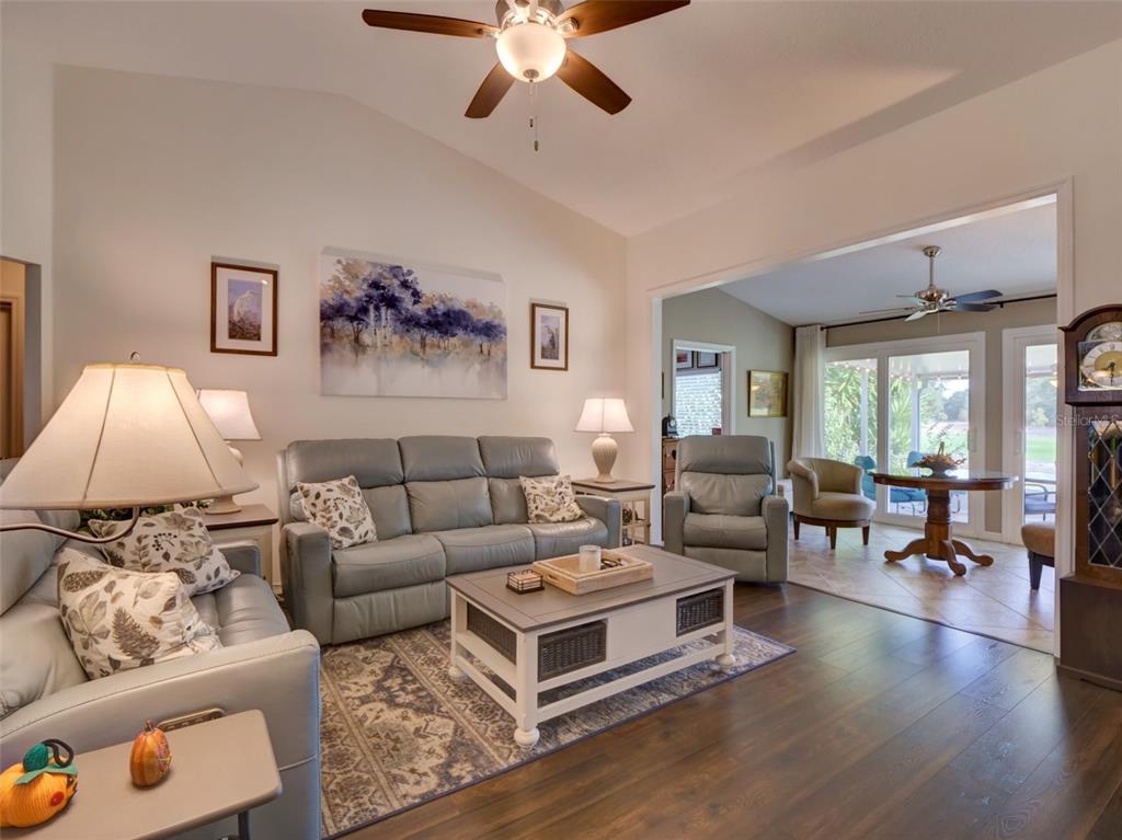 4704 River Ridge Drive Leesburg, FL 34748 - Photo 10 of 40 a living room with furniture and a large window