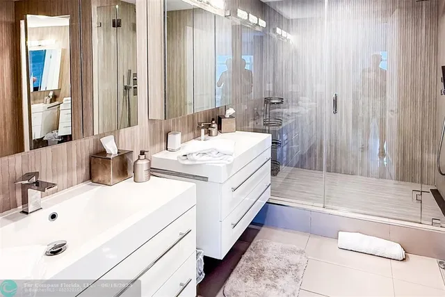 a bathroom with a double vanity sink mirror and double