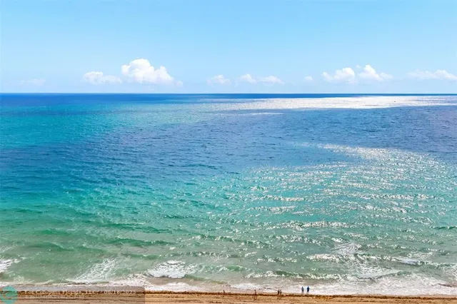 a view of an ocean and a yard
