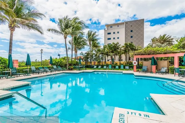 a view of a swimming pool with a lounge chairs