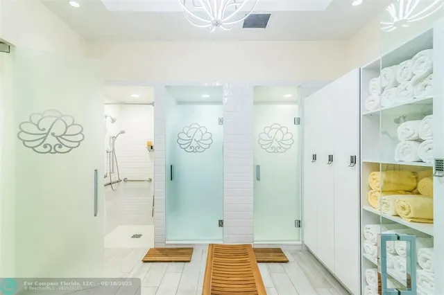 a bathroom with a bathtub and shower