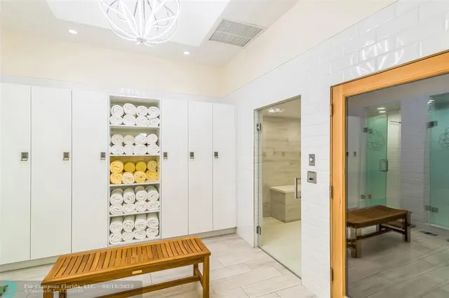 a bathroom with a glass shower door