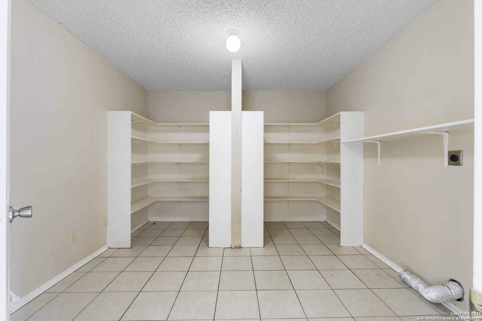 1555 Jasmine Schertz, TX 78154 - Photo 13 of 23 a view of walk in closet with empty racks