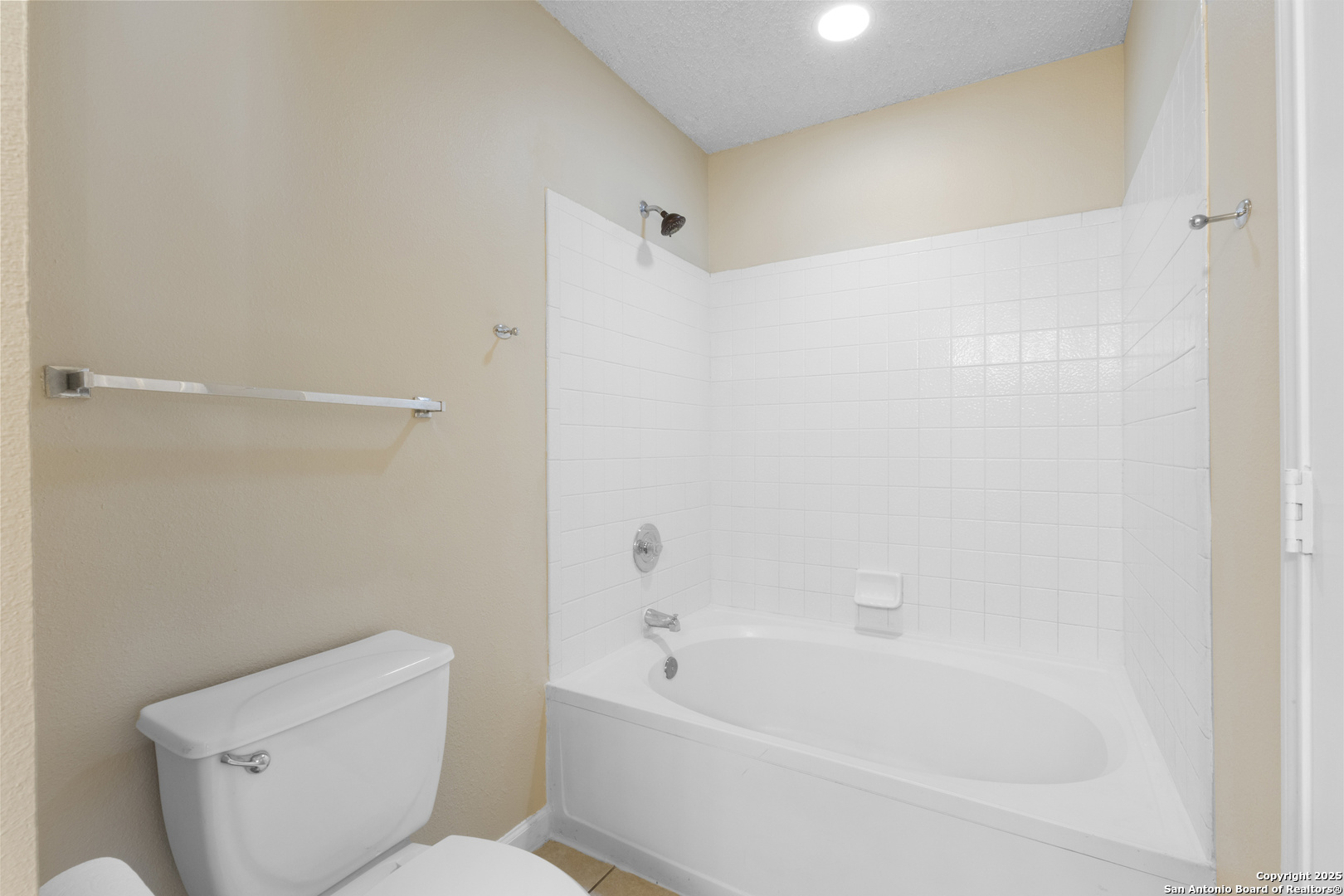 1555 Jasmine Schertz, TX 78154 - Photo 16 of 23 a bathroom with a toilet and a bathtub