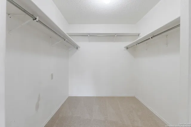 a view of an empty walk in closet