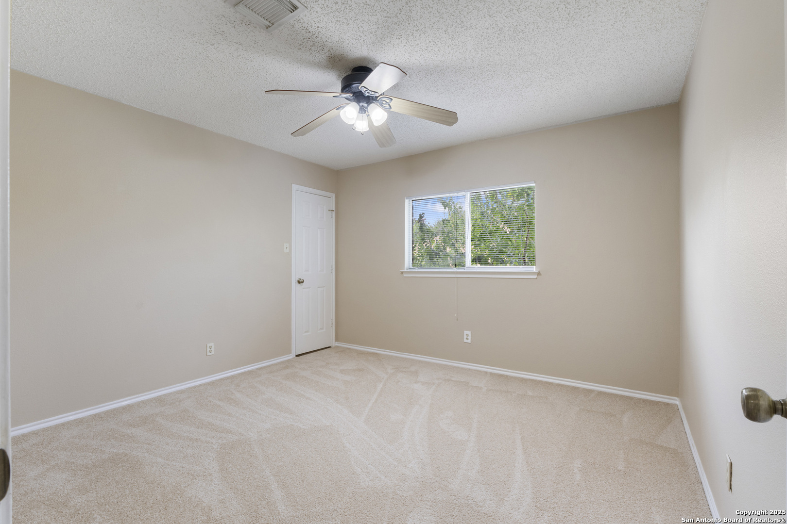 1555 Jasmine Schertz, TX 78154 - Photo 19 of 23 a view of an empty room with a fan