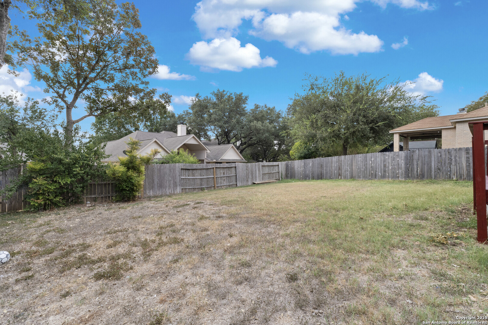 1555 Jasmine Schertz, TX 78154 - Photo 22 of 23 a view of a yard with wooden fence