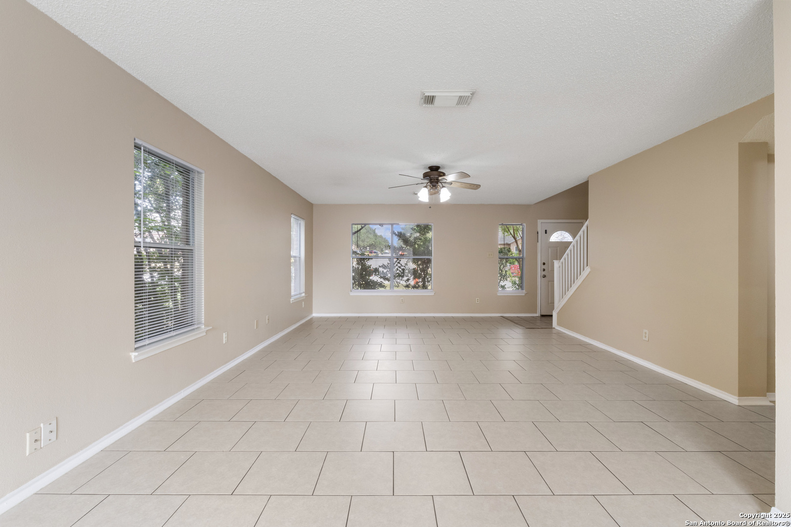 1555 Jasmine Schertz, TX 78154 - Photo 5 of 23 an empty room with windows and entrance