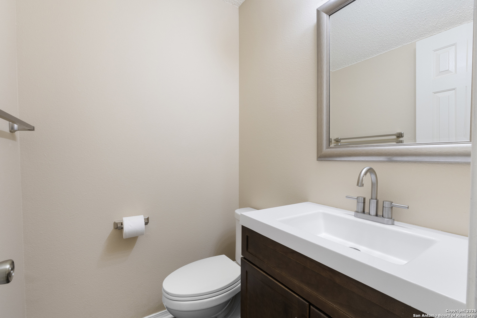 1555 Jasmine Schertz, TX 78154 - Photo 6 of 23 a bathroom with a sink a toilet and mirror
