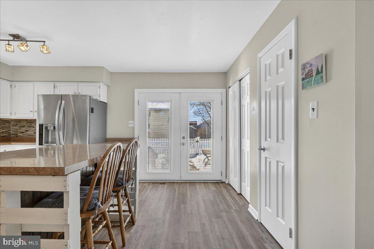 1158 Grove Street Pottstown, PA 19464 - Photo 11 of 26 a view of a hallway with wooden floor and windows