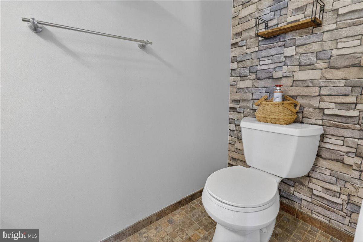 1158 Grove Street Pottstown, PA 19464 - Photo 12 of 26 a toilet sitting next to a white wall