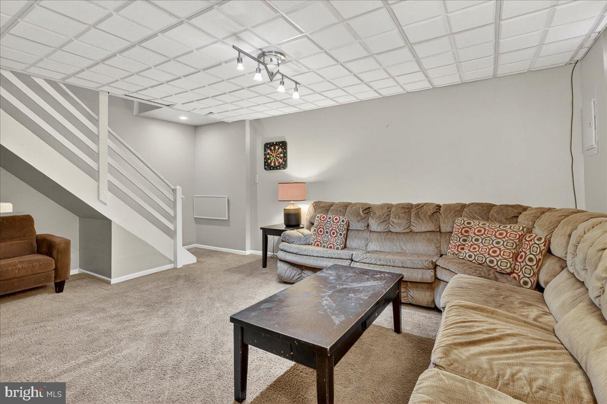 1158 Grove Street Pottstown, PA 19464 - Photo 23 of 26 a living room with furniture and a potted plant