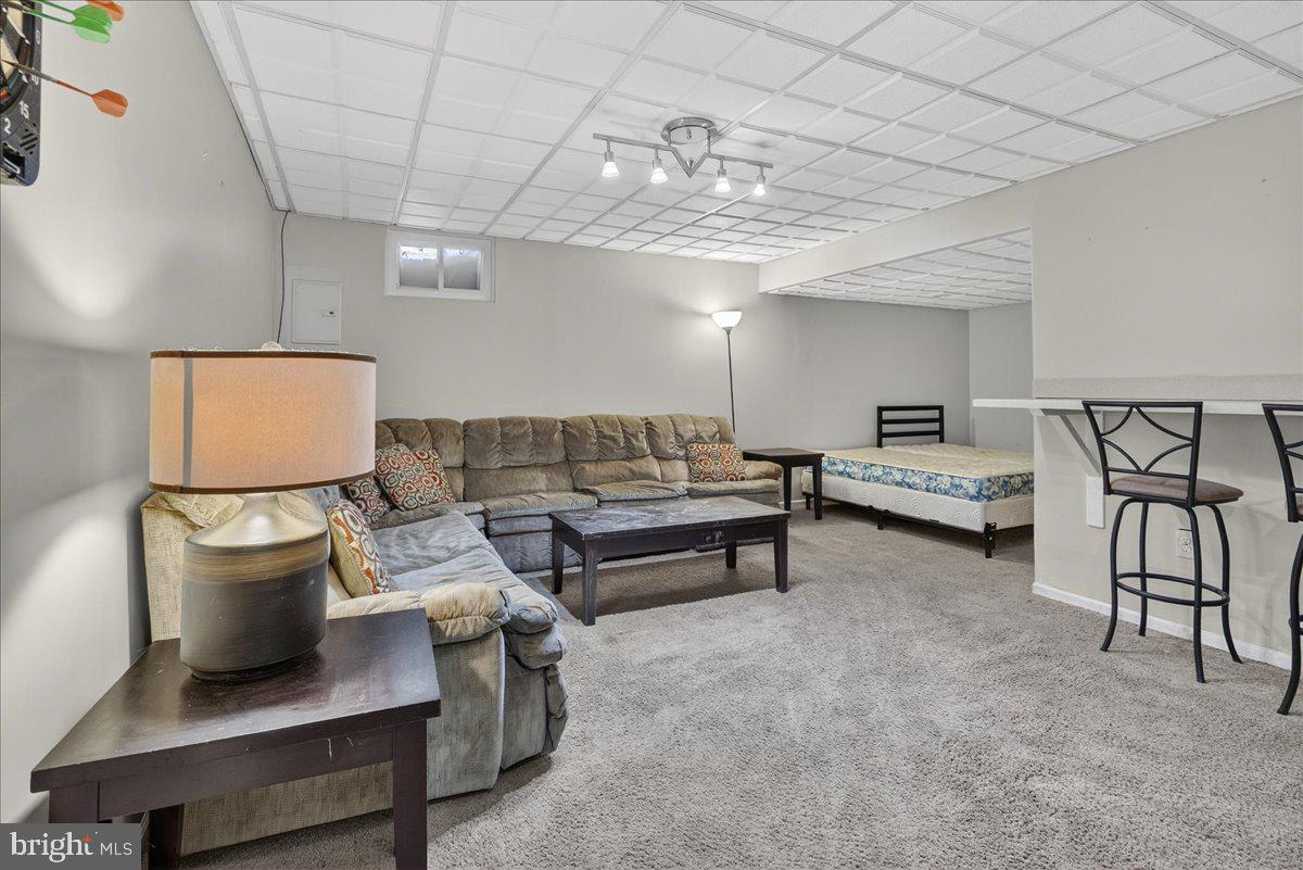 1158 Grove Street Pottstown, PA 19464 - Photo 24 of 26 a living room with furniture and a chandelier