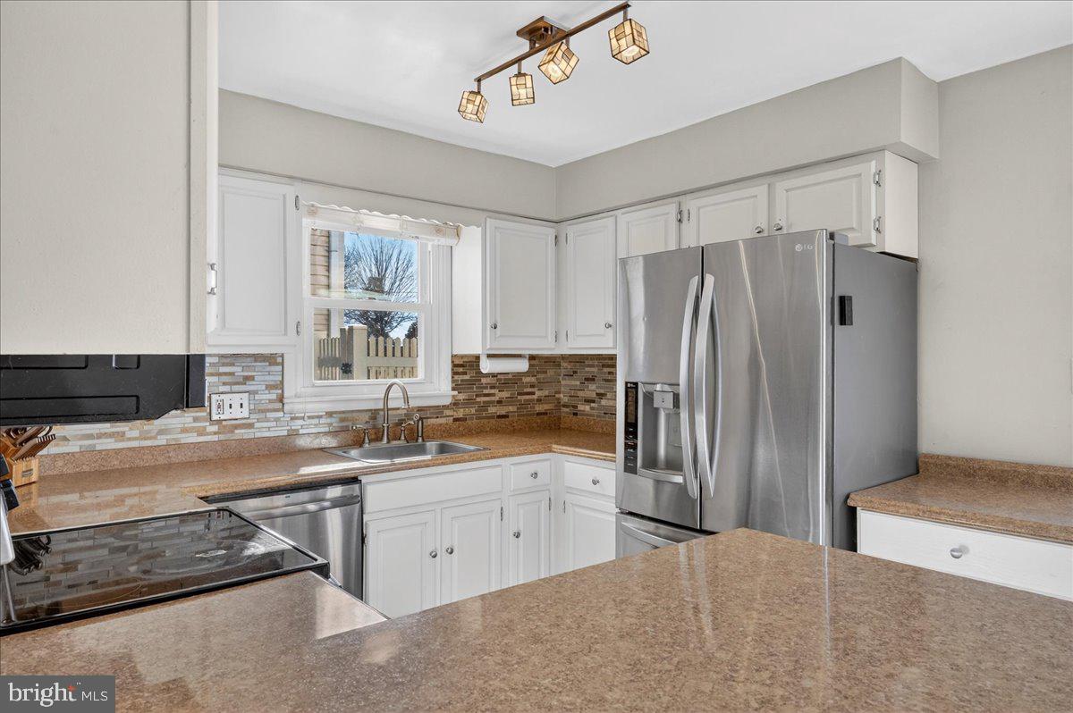 1158 Grove Street Pottstown, PA 19464 - Photo 8 of 26 a kitchen with a sink stove and refrigerator