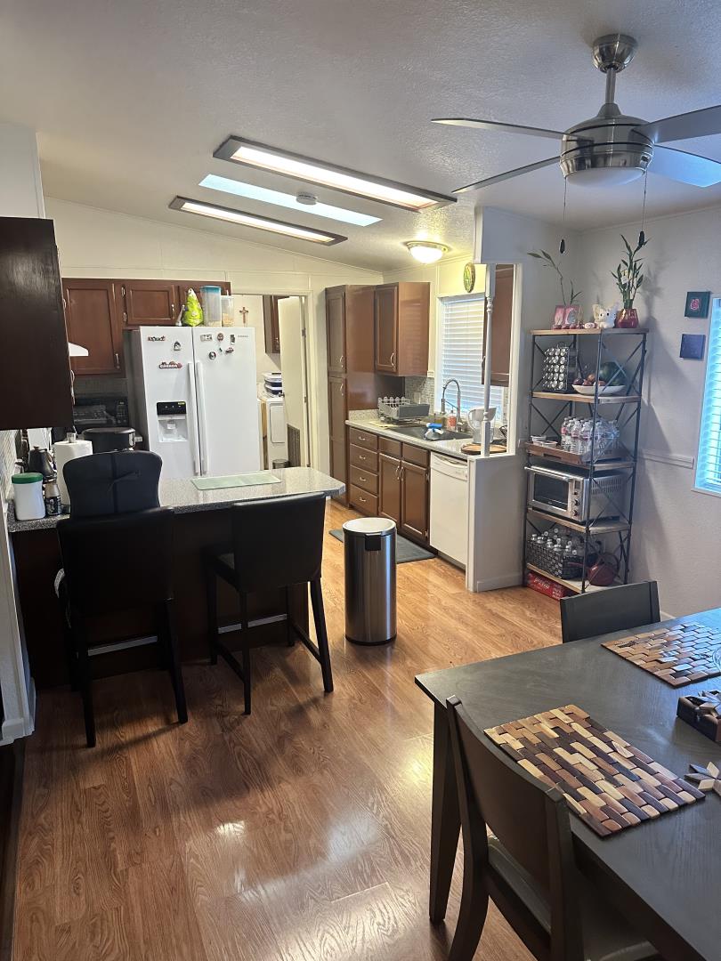 6130 Monterey Road, Unit 9 San Jose, CA 95138 - Photo 13 of 27 a room with furniture a desk and chair