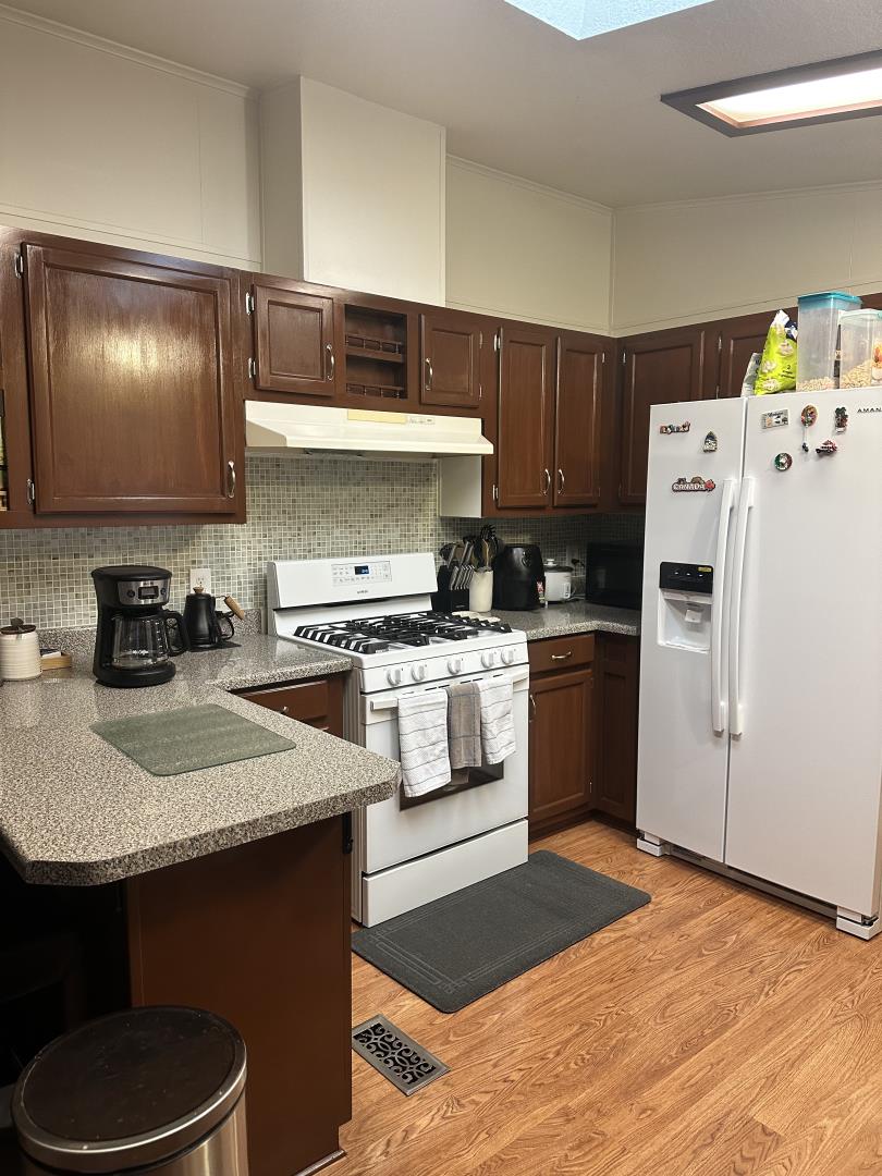 6130 Monterey Road, Unit 9 San Jose, CA 95138 - Photo 15 of 27 a kitchen with a sink a stove and refrigerator