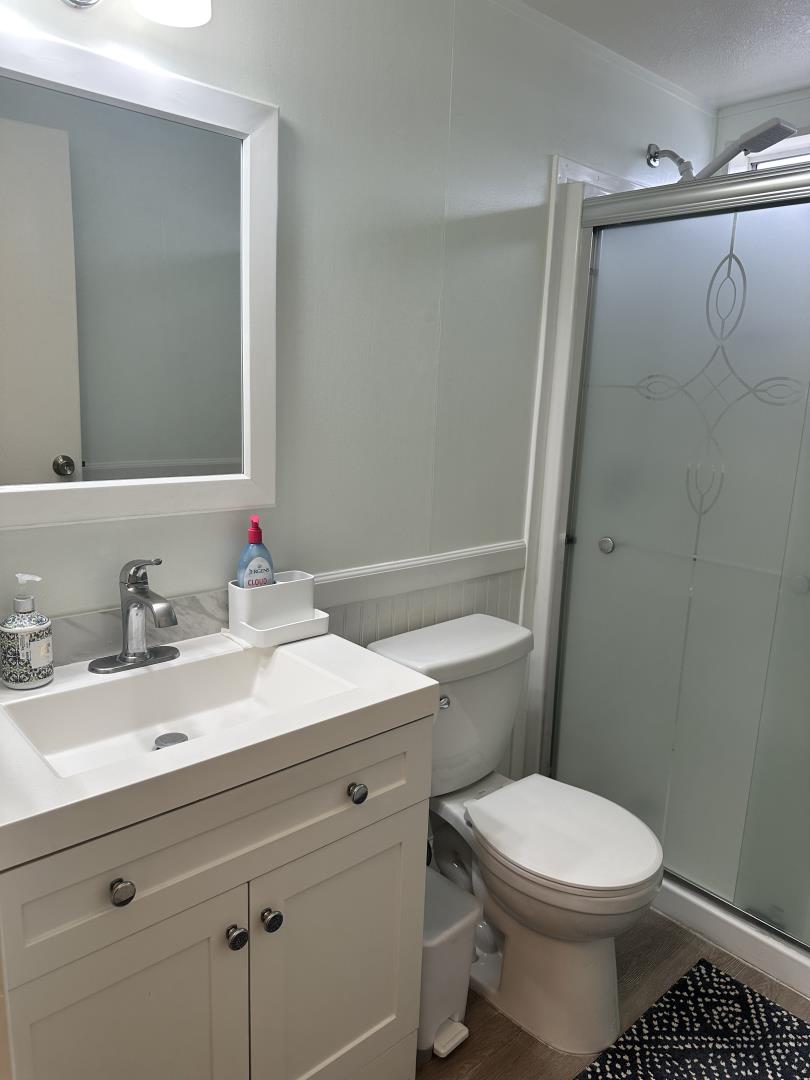 6130 Monterey Road, Unit 9 San Jose, CA 95138 - Photo 20 of 27 a bathroom with a sink a toilet and shower