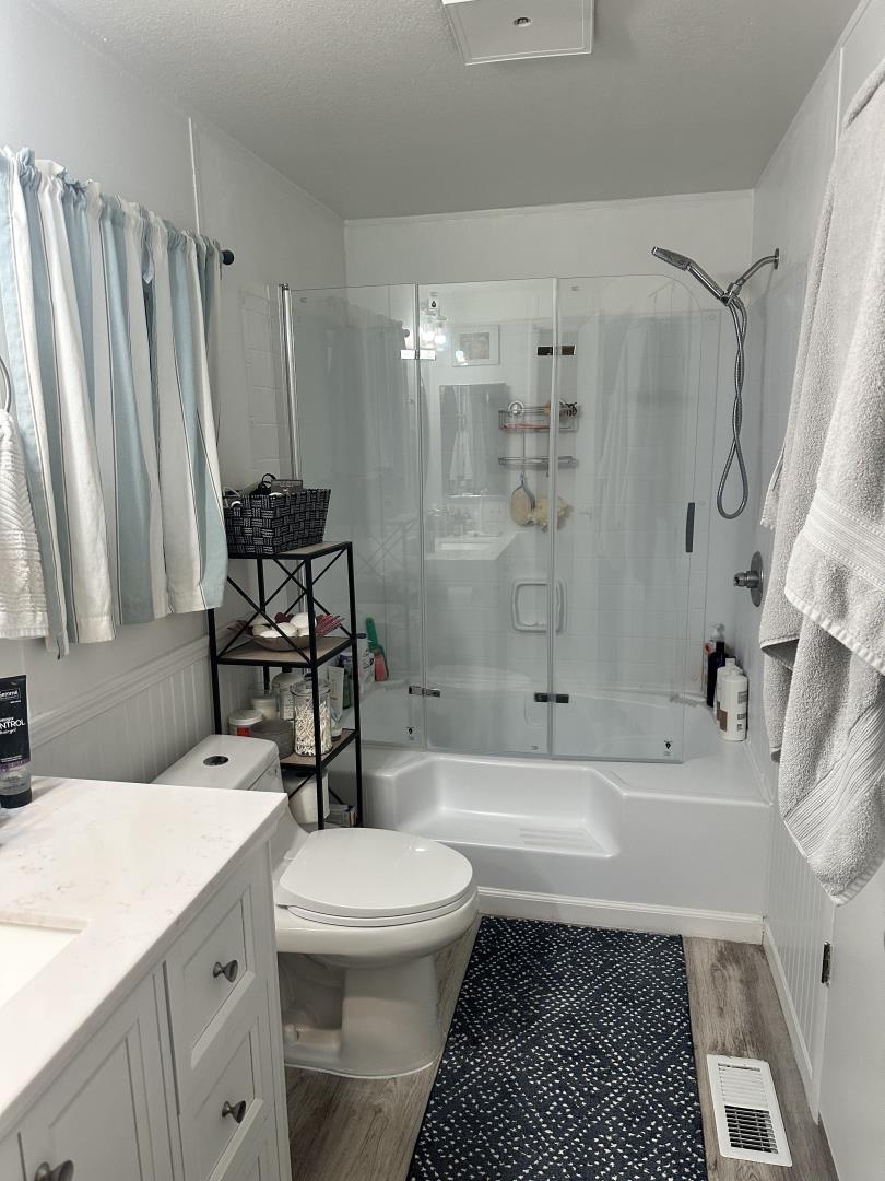 6130 Monterey Road, Unit 9 San Jose, CA 95138 - Photo 25 of 27 a bathroom with a sink toilet and shower