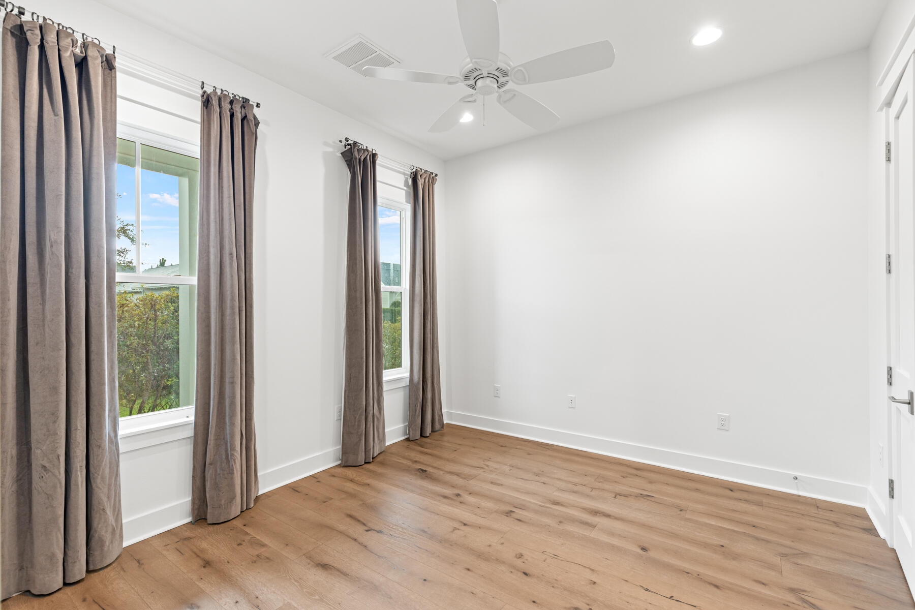 79 Basal St Inlet Beach Inlet Beach, FL 32461 - Photo 14 of 41 an empty room with wooden floor and door