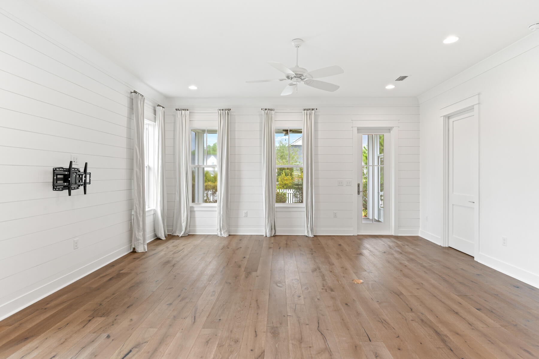 79 Basal St Inlet Beach Inlet Beach, FL 32461 - Photo 18 of 41 a view of an empty room with wooden floor and windows