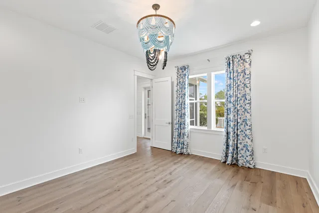 a bathroom with a bathtub and next to a window