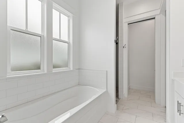 a en suite bathroom with 2 sink and a mirror