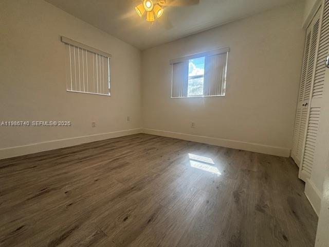 5215 Southwest 128th Avenue Miami, FL 33175 - Photo 12 of 20 an empty room with wooden floor and windows