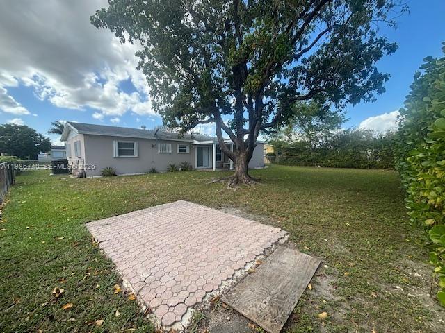 5215 Southwest 128th Avenue Miami, FL 33175 - Photo 16 of 20 a view of house with garden space and trees