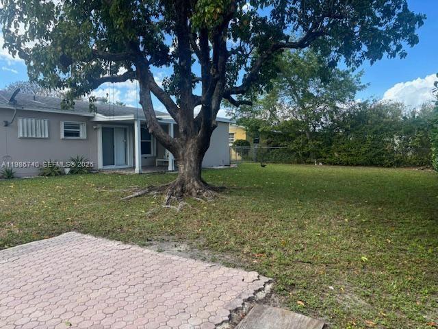 5215 Southwest 128th Avenue Miami, FL 33175 - Photo 17 of 20 a backyard of a house with lots of green space