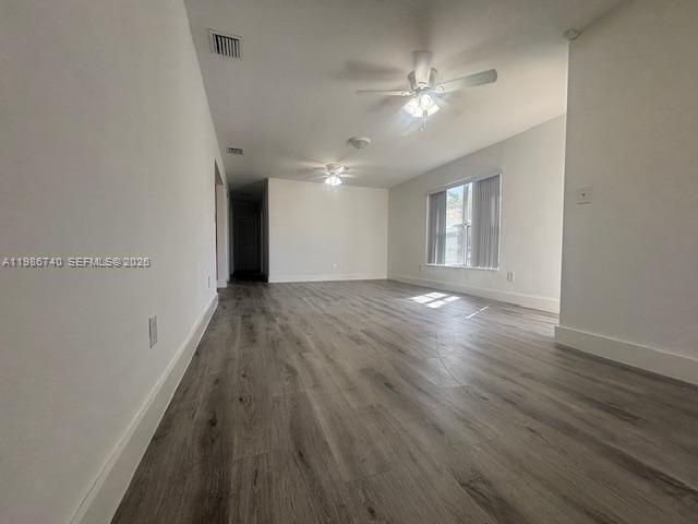 5215 Southwest 128th Avenue Miami, FL 33175 - Photo 2 of 20 wooden floor in an empty room with a window