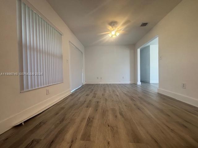 5215 Southwest 128th Avenue Miami, FL 33175 - Photo 4 of 20 wooden floor in an empty room with a window