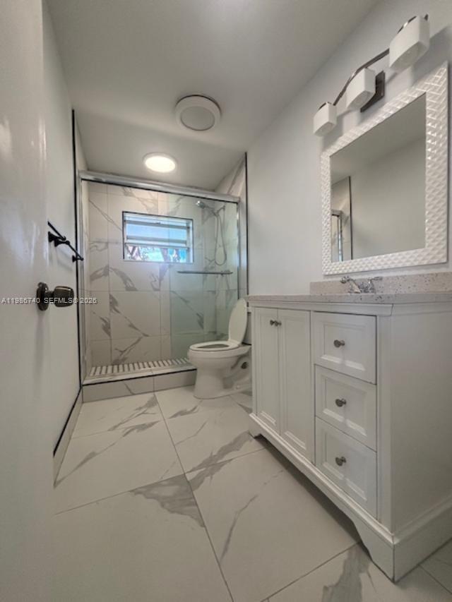 5215 Southwest 128th Avenue Miami, FL 33175 - Photo 9 of 20 a bathroom with a shower and a toilet