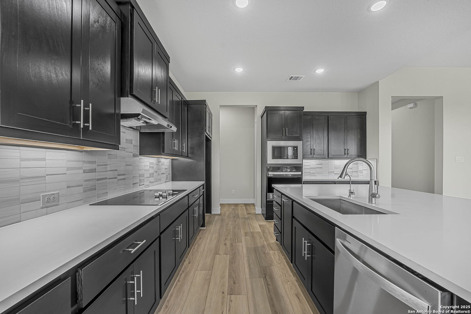 6821 Arbor Falls Fair Oaks Ranch, TX 78015 - Photo 14 of 50 a kitchen with stainless steel appliances granite countertop counter space a sink and cabinets