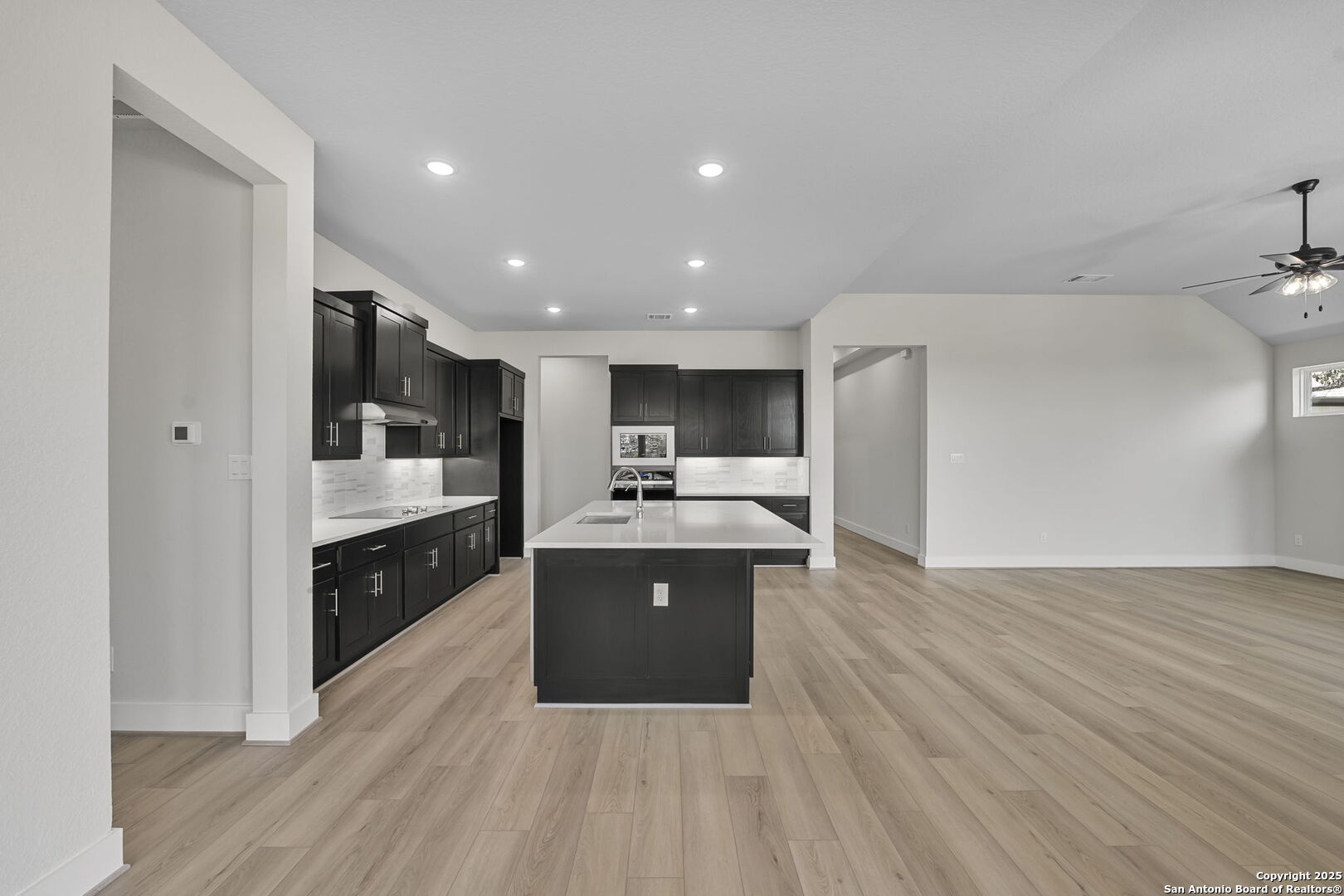 6821 Arbor Falls Fair Oaks Ranch, TX 78015 - Photo 15 of 50 a large kitchen with stainless steel appliances a sink and cabinets