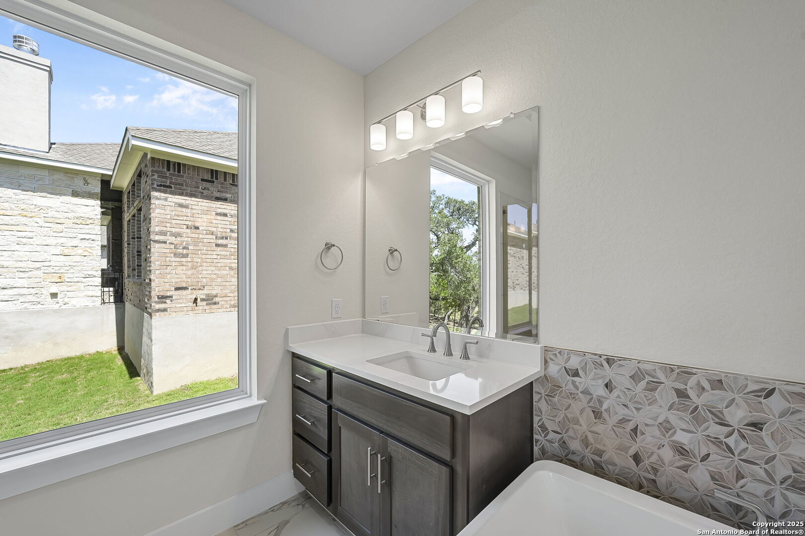 6821 Arbor Falls Fair Oaks Ranch, TX 78015 - Photo 26 of 50 a bathroom with a sink and a mirror