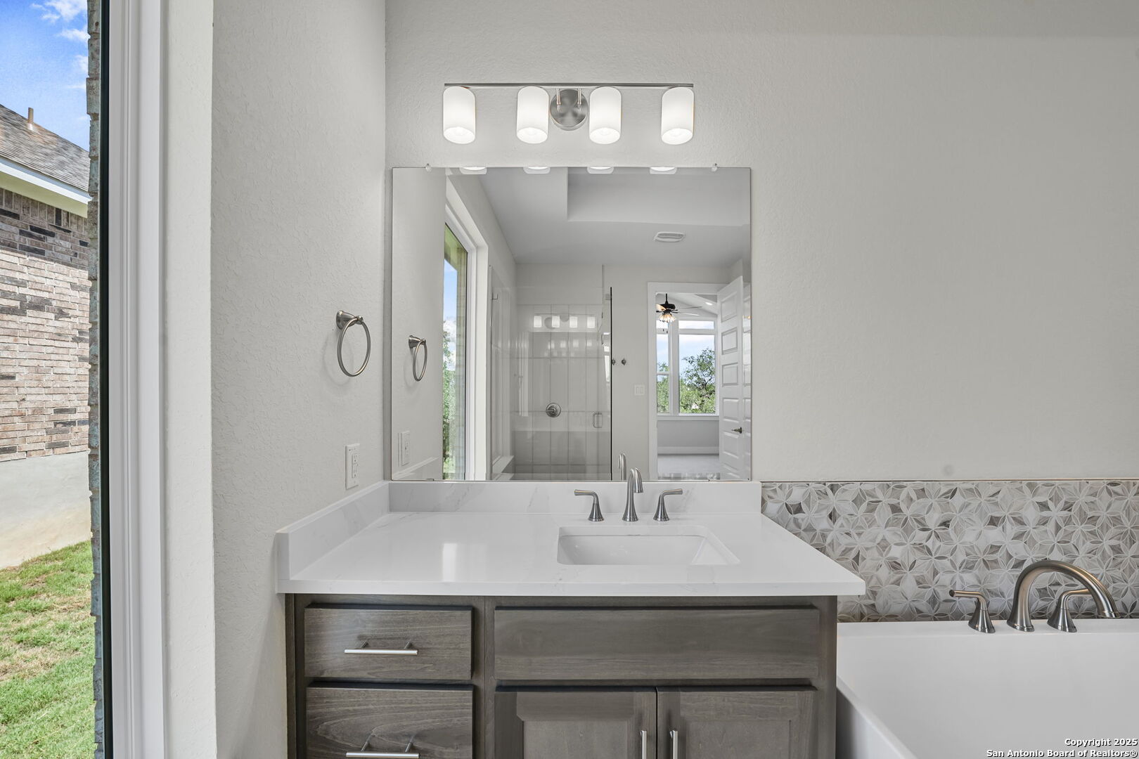 6821 Arbor Falls Fair Oaks Ranch, TX 78015 - Photo 27 of 50 a bathroom with a sink and a mirror