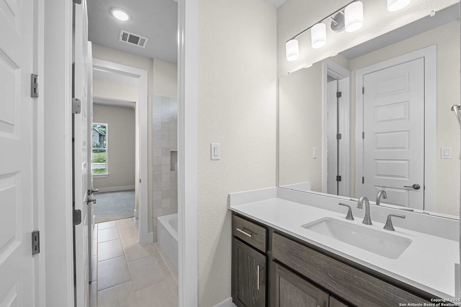 6821 Arbor Falls Fair Oaks Ranch, TX 78015 - Photo 31 of 50 a bathroom with a sink and a mirror