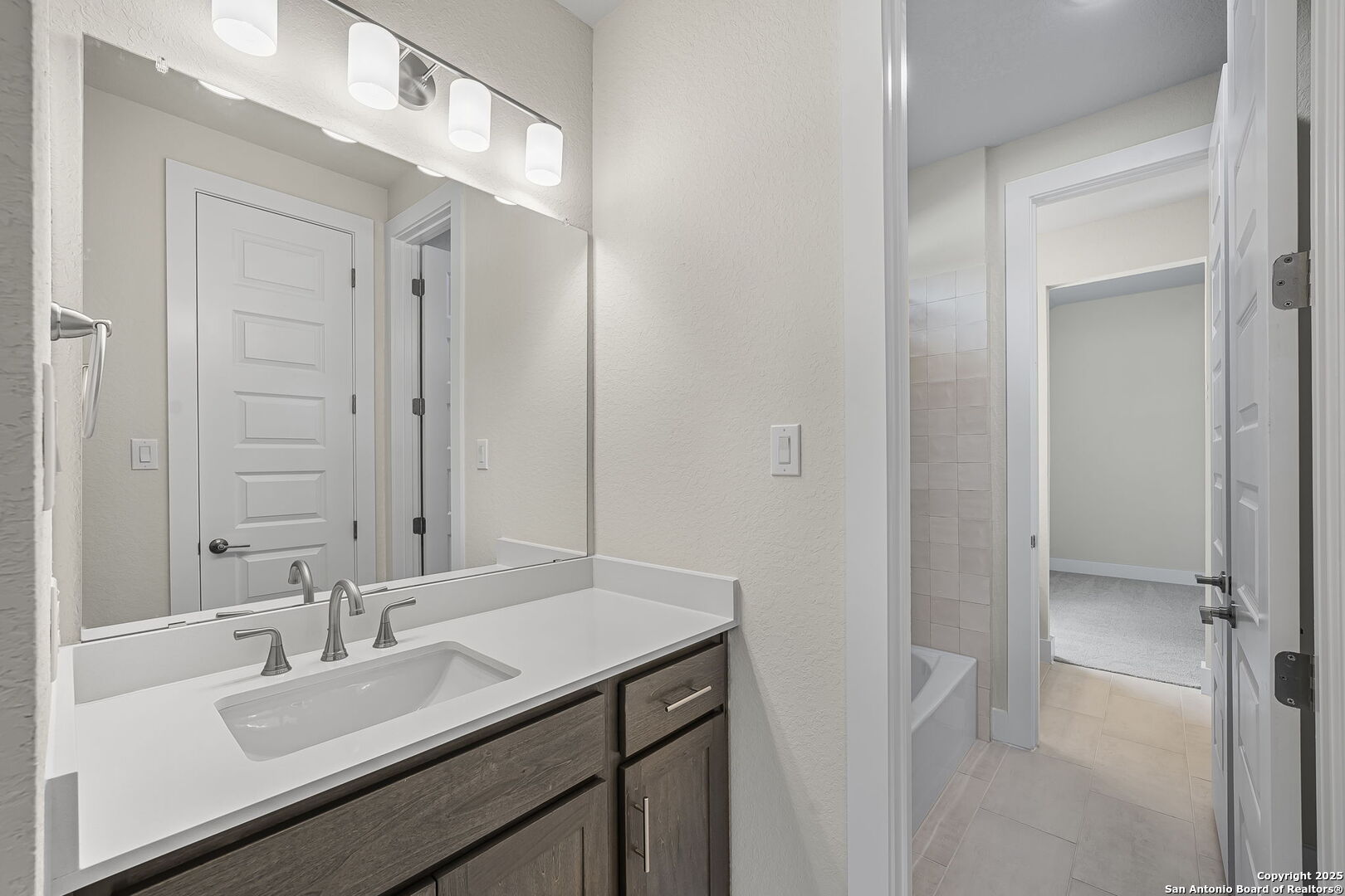6821 Arbor Falls Fair Oaks Ranch, TX 78015 - Photo 33 of 50 a bathroom with a sink and a mirror