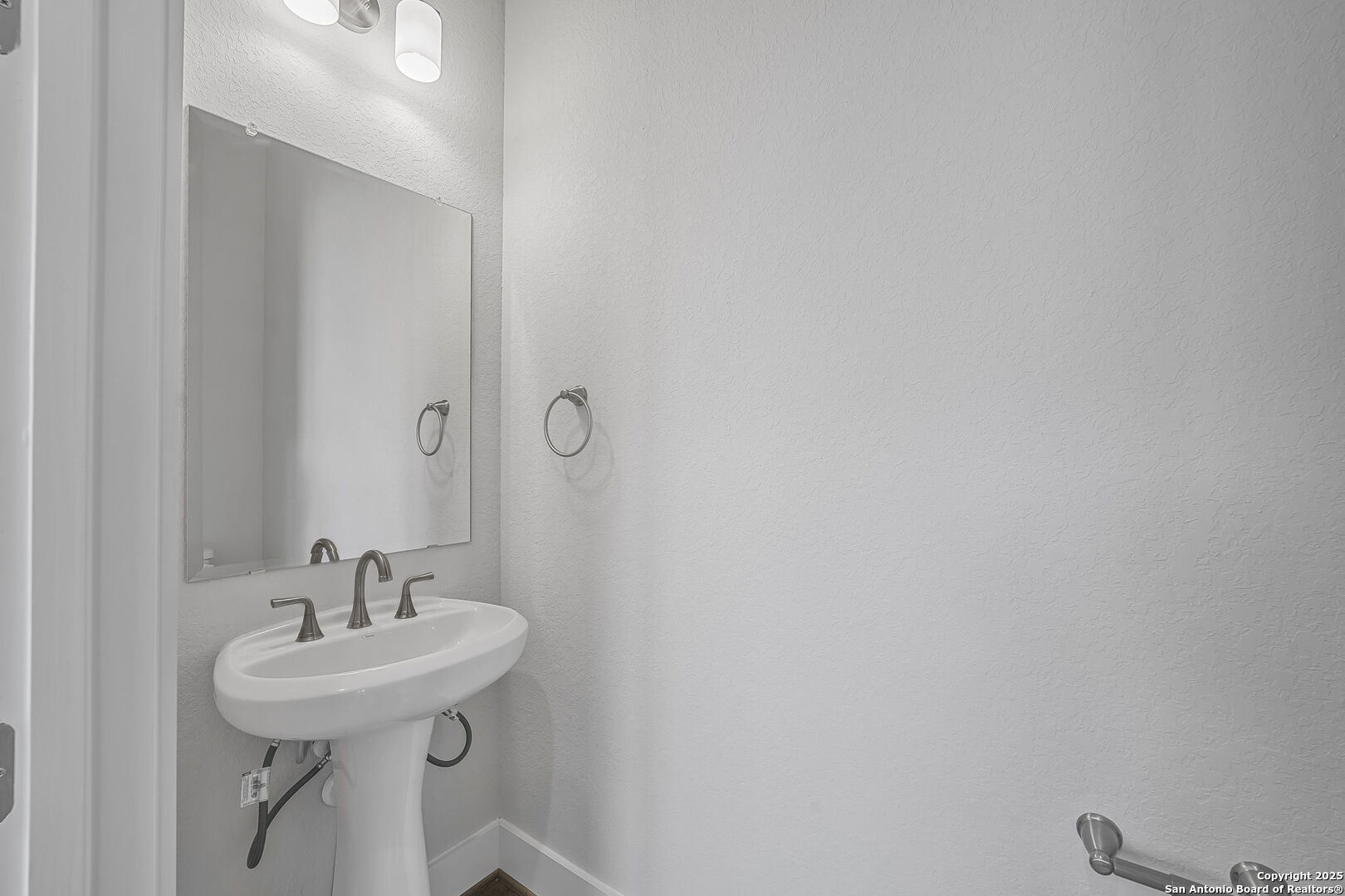 6821 Arbor Falls Fair Oaks Ranch, TX 78015 - Photo 38 of 50 a bathroom with a sink a mirror and a toilet