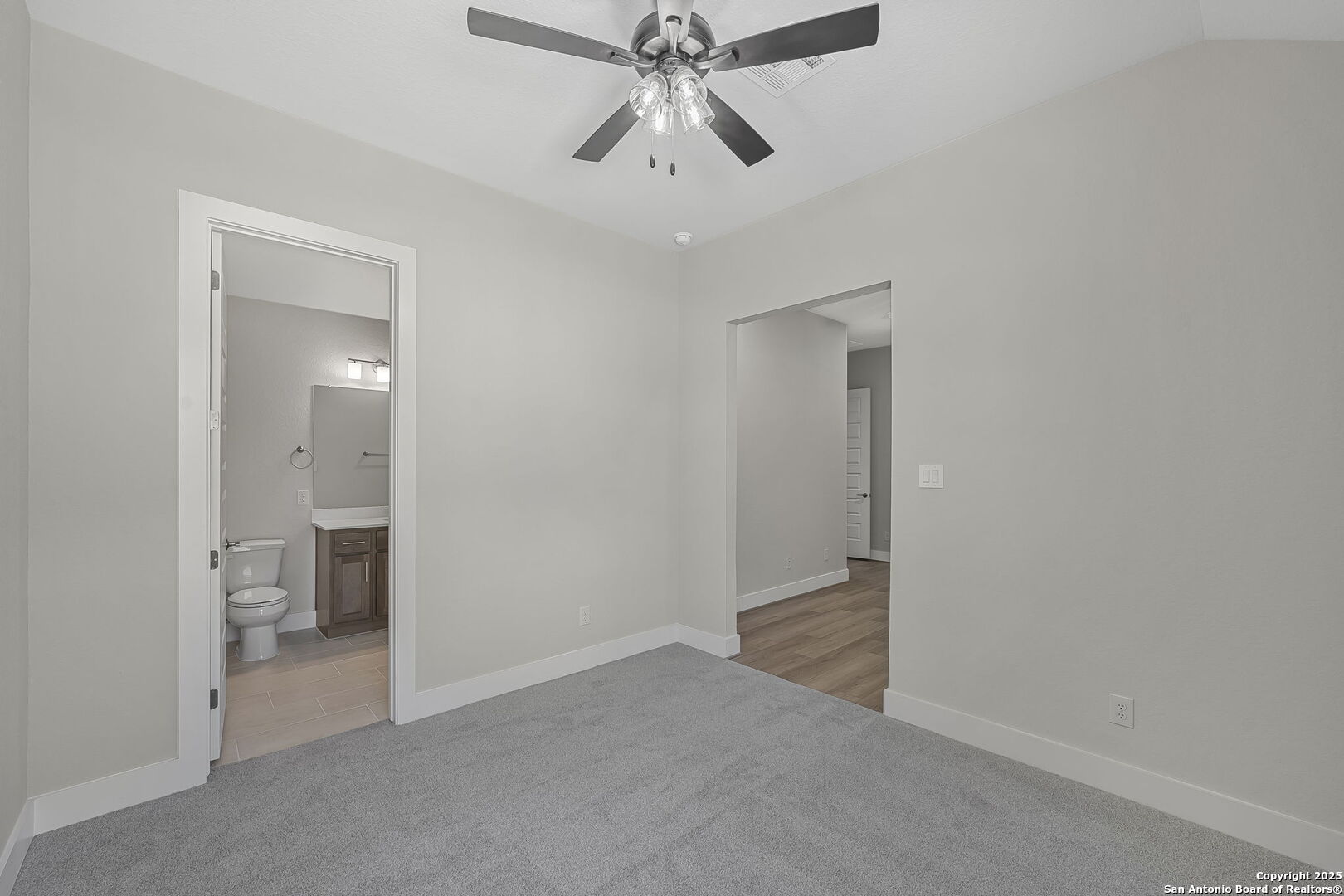 6821 Arbor Falls Fair Oaks Ranch, TX 78015 - Photo 42 of 50 a view of an empty room and chandelier fan and fire place