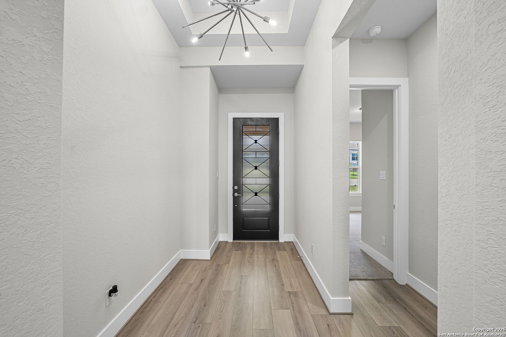 6821 Arbor Falls Fair Oaks Ranch, TX 78015 - Photo 6 of 50 a view of hallway with wooden floor and stairs