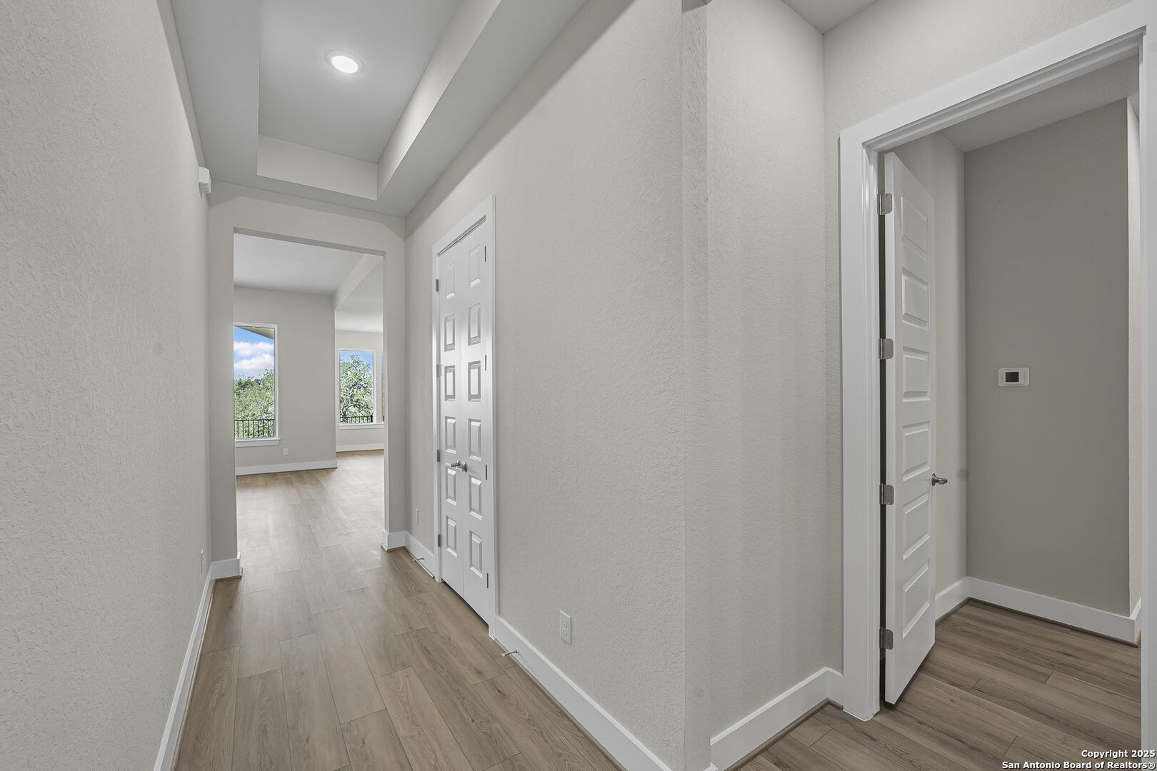 6821 Arbor Falls Fair Oaks Ranch, TX 78015 - Photo 8 of 50 a view of a hallway with wooden floor