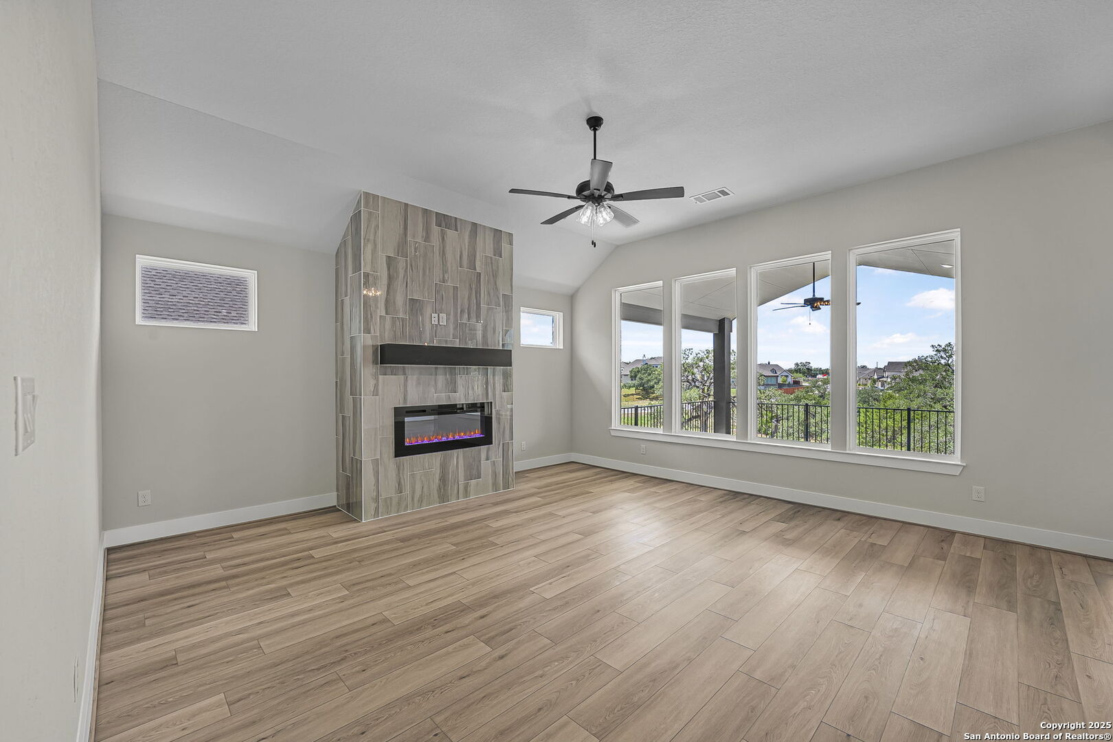 6821 Arbor Falls Fair Oaks Ranch, TX 78015 - Photo 9 of 50 a view of empty room with wooden floor and fireplace