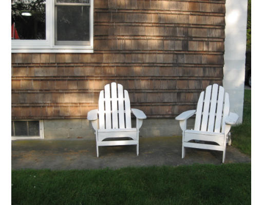 a view of outdoor space with deck and bench