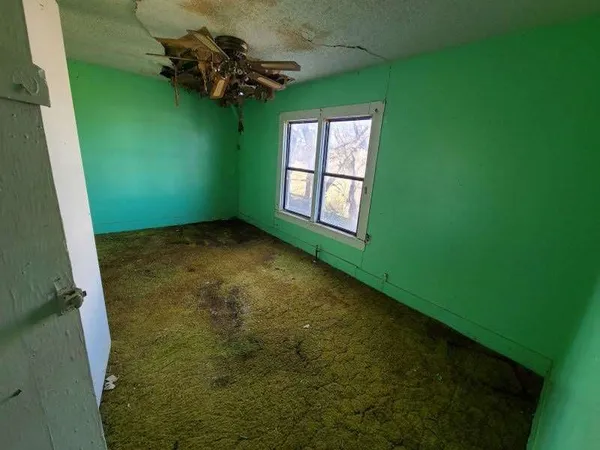 a view of a room that has a window