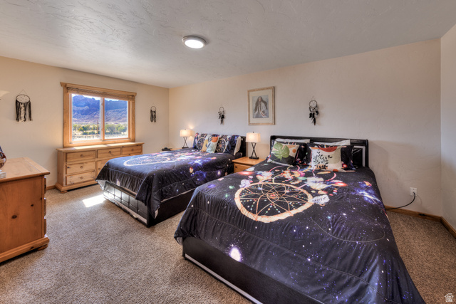 3461 Westwater Road, Unit 6 Moab, UT 84532 - Photo 22 of 33 Bedroom featuring light carpet and baseboards
