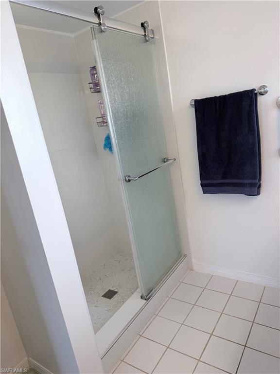 7750 Jewel Lane, Unit 101 Naples, FL 34109 - Photo 20 of 28 a bathroom with a shower and toilet