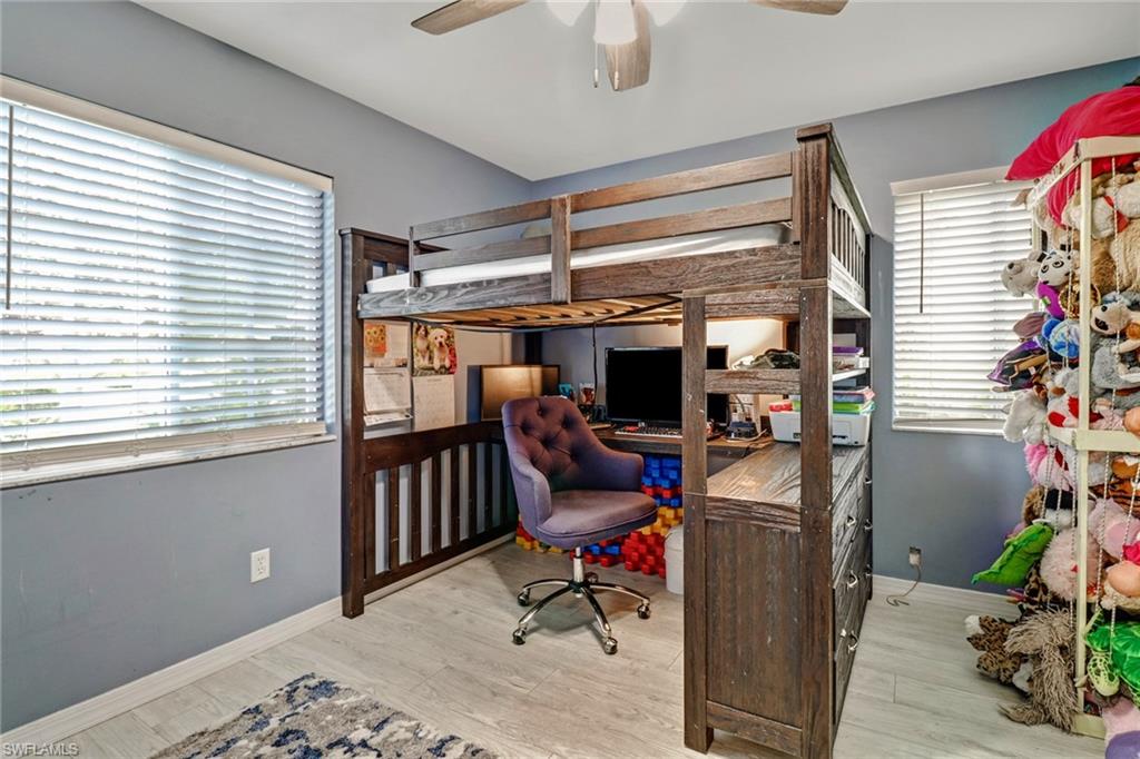 7750 Jewel Lane, Unit 101 Naples, FL 34109 - Photo 21 of 28 a view of a workspace with furniture and a window
