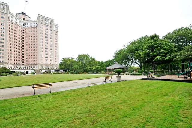 a view of a garden with a lake view